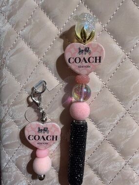 Pink and black phone charm and rhinestone stylus pen.